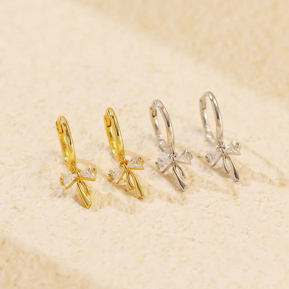BOW HUGGIE EARRINGS