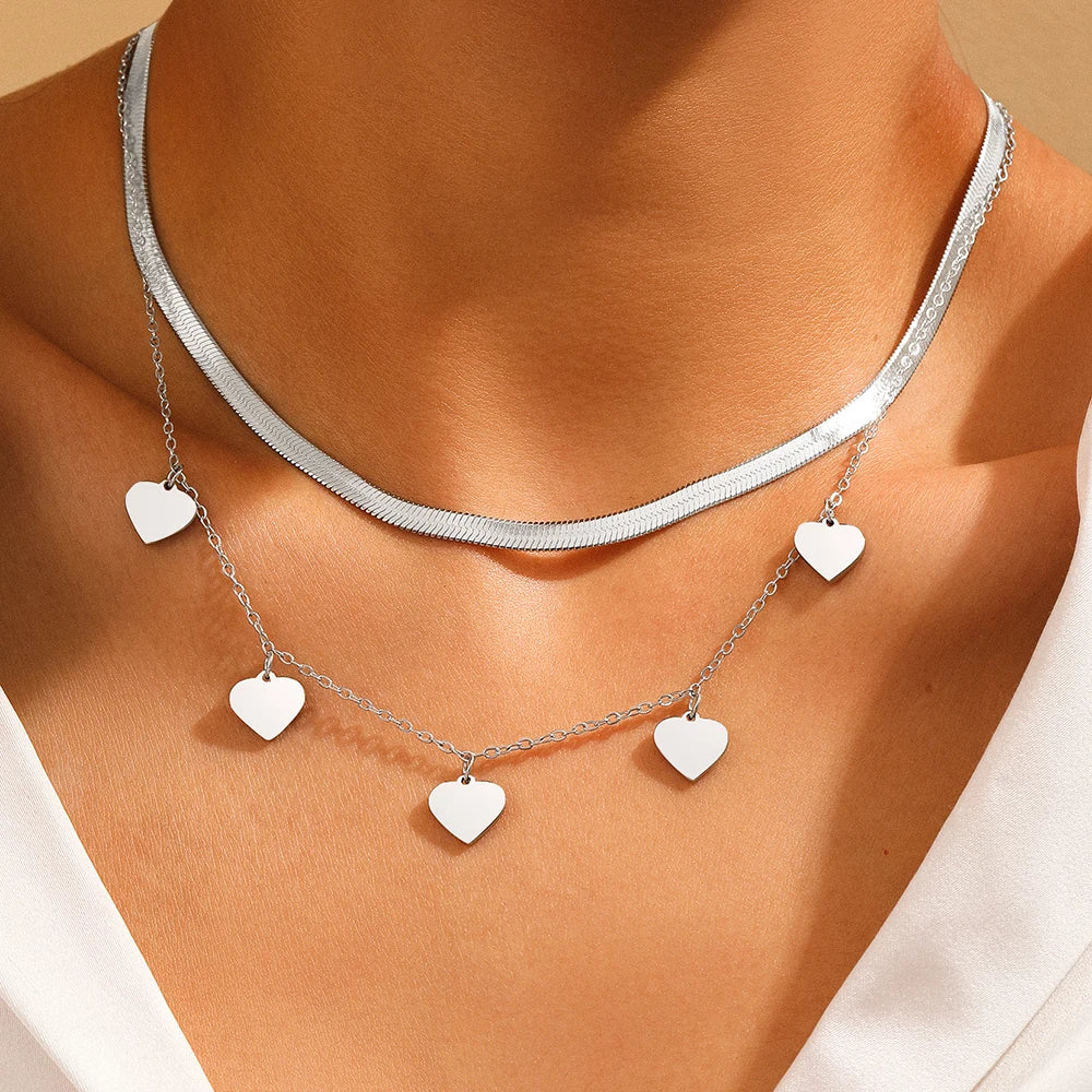 SNAKE BONE HEART NECKLACE